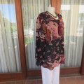 Bohemian look slip-over long sleeve top. V-neckline. Size 44/20 by `Penny C`. New condition.