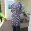 Stunning cross-over long white, black and grey top. By `Donna-Claire`. Size 44/20. New condition.