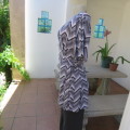 Stunning cross-over long white, black and grey top. By `Donna-Claire`. Size 44/20. New condition.