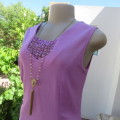 Day/evening wear violet colour sleeveless top with princess style front. Size 36/12. New condition.