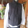 Zippered black suede look waistcoat. Polyester inner. Size 36/12 by `Woolworths`. New condition.