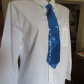 Be Different! Wear this royal blue sequined necktie.with elastic around neck. New condition.