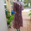 Beautiful vintage dress in white with lilac,mustard and beige lines. By JANE LANFORD size 50. As new
