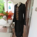 Make a statement with this black long sleeve summer coat in creased polyester. By WWW size 32/8