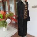 Make a statement with this black long sleeve summer coat in creased polyester. By WWW size 32/8