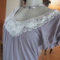 Silvergrey slip over top with tiny white polkadots.Small elasticated raglan sleeves. Size 32/8.
