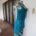 Get noticed in this high/low dark turquoise stretch lace sleeveless top.Size 34/10. As new.