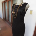 Elegant black evening dress in maxi lenght. Princess style front. Size 34/10. Made by `BOUTIQUE`.