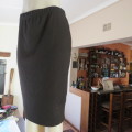 Stunning black pencil skirt by `ROSSELINI` in size 38/14. Just under knee length. New condition.