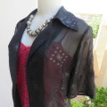Black short sleeve open hanging glamour top with silver sparkles in diamond design size 34/10.