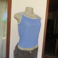 `NIKE` sports top in cobalt blue. Best fit size 38/14. In Dri-Fit lycra/polyester. New condition.