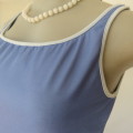 `NIKE` sports top in cobalt blue. Best fit size 38/14. In Dri-Fit lycra/polyester. New condition.
