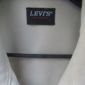 Men`s safari style short sleeve shirt by LEVI`s in beige size Medium. Chest 108 cm. New condition.