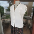 Soft cream embroidered top in size 36/12 by ACKERMANS. V neckline and button down. Good condition..