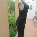 Glamour sleeveless black and silver horizontal patterned see-through top. Lined to waist. Size 34