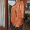 Stunning boutique made silky satin top in light brick. Size 38/14. Short sleeves. Smart wear! As new