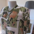 Pattern blocked cream top with green and peach flowers.Collarless with V. Size 42/18 by CHARLOTTE