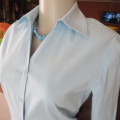 High quality long sleeve light blue used shirt by ZINC from London. Size 34/10. In stretch cotton.