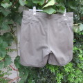Fine cotton men`s chino shorts by WOOLWORTHS in size 42. Crocodile green. With turnups. As new