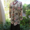 Pretty slip over silky polyester rich cream top with red and black unique designs.Size 44/20.As new