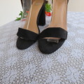 As new black block heel suede shoes with ankle straps and open toes. By MRP in size 3