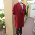 Knitted brick colour long top.Tiny knit-on sleeves and wide flowing collar.Size 46/22 by RENE TAYLOR