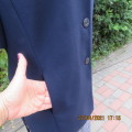 Smart navy tailored jacket with 3 buttons on front.Open collar. Slit seam pockets.Size 42/18.New con