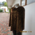 Warm polyester velvet animal print golden brown and caramel long sleeve slip over top.Size 42/18