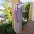 Amazing 2 pc skirt suit in soft lilac.Tailored short sleeve jacket and pencil skirt.Size 32/8.WOOLW.