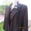 High quality 2 pc black OASIS skirt suit.Paneled A Line skirt.Long sleeve button down jacket.Size 40