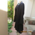High quality 2 pc black OASIS skirt suit.Paneled A Line skirt.Long sleeve button down jacket.Size 40