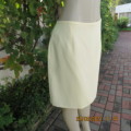 Daffodil yellow knee length fully lined pencil skirt by FOSHINI in size 40/16. Zip at back.As new.