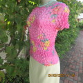 New slip over watermelon pink with yellow flowers bubble rayon top. Best fit 32 to 36. Short sleeves