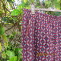 As new loose printed pants with tapered legs in maroon with navy/white pattern.Size 48/24 by DONNA C