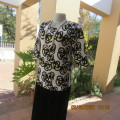 Eyecatching textured white polyester slip over top with yellow/black abstract patterns.Size 34/10