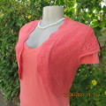 Lovely coral colour capped sleeve bolero in stretch acrylic lace. Size 34/10 by FASHION EXPRESS.