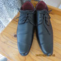Pair of Men`s black ponted fashion shoes by RENAULT in size 9. With laces. As new