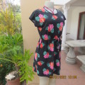 Sweet size 36/12 slip over mini dress with black/white polkadot background and floral design.