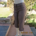 Classic light brown striped cropped pants in firm polycotton stretch fabric.Size 32/8. As new.