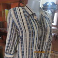 Smart cream,caramel and blue checked short sleeve top size 40 to 42.Viscose/cotton and poly blend.