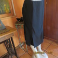 High quality as new black FINNEGANS skirt in size 34/10. Bandless.In 7 panels with 2 inverted pleats