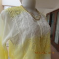 Sheer embellished polyester paneled slip over yellow top. Size 36/12. Three button opening.As new