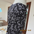 Sleek black/white floral 100% polyester fully lined skirt.Size 34/10 New condition by MISS CASSIDY