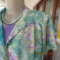 Get noticed in this vintage TORI FASHION`S colourful top in size 36/12. Button down front. New cond.