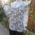 Casual black+white geometric print sleeveless vest style top. U neckline. By IMAGE in size 32/8.