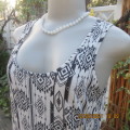 Casual black+white geometric print sleeveless vest style top. U neckline. By IMAGE in size 32/8.