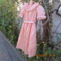 Shiny peach satin puffed short sleeve dress for 11-12 year old girl. Suitable for special occasion.