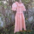 Shiny peach satin puffed short sleeve dress for 11-12 year old girl. Suitable for special occasion.