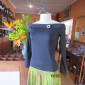 Hot black off the shoulder top by H+M size 32/8. Fold over collar. Poly stretch fabric. As new.