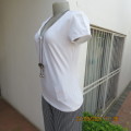 Pretty white capped sleeve feminine T shirt. Size 38/14 by WOOLWORTHS in stretch cotton. As new.